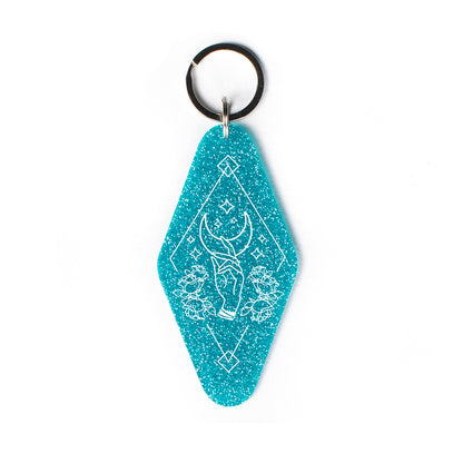 Hand Reaching for Moon Glitter Keychain