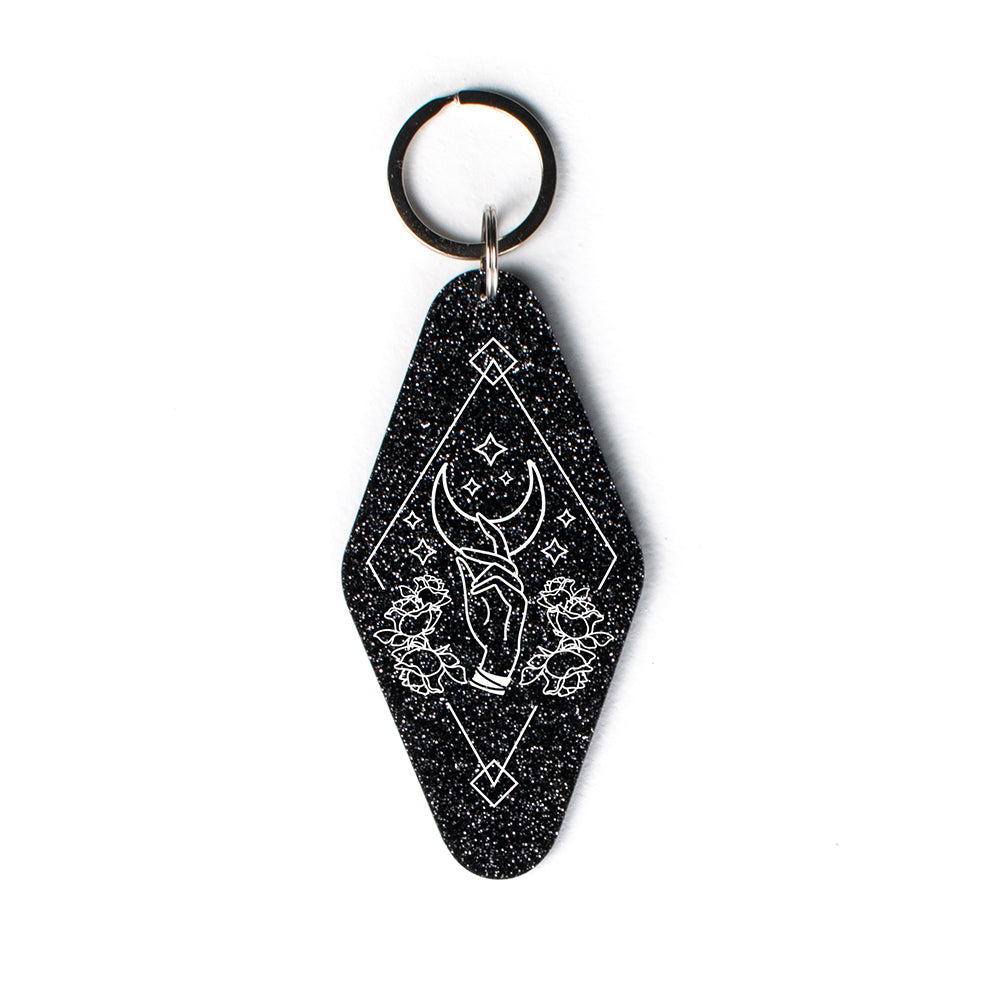 Hand Reaching for Moon Glitter Keychain