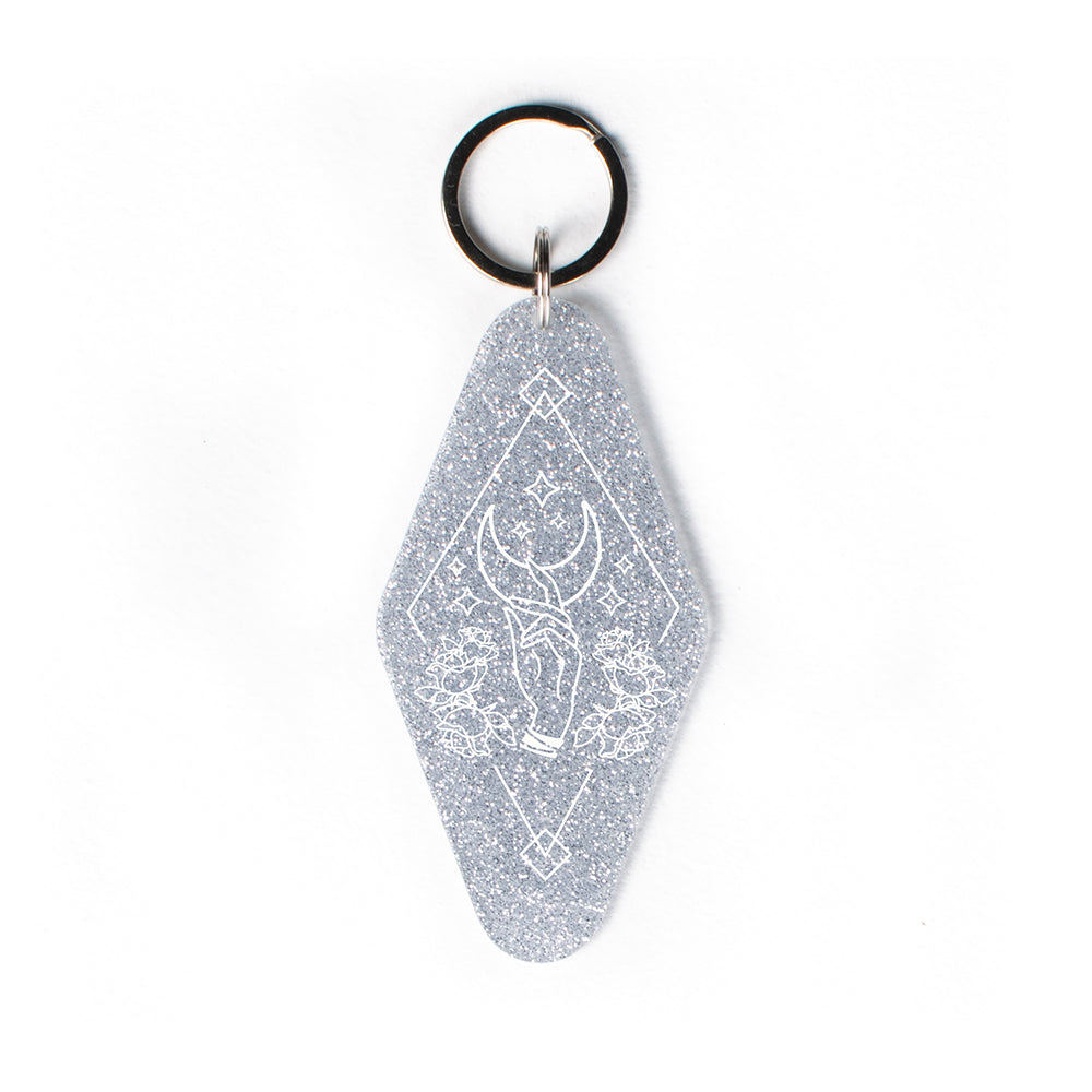 Hand Reaching for Moon Glitter Keychain